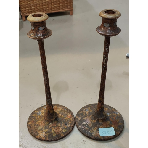 340A - A pair of WWII Japanese prisoner of war carved and decorated candlesticks