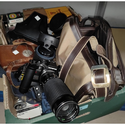 48 - Two vintage Olympus OM10 SLR cameras; various lenses and accessories; a boxed Brownie Reflex, other ... 