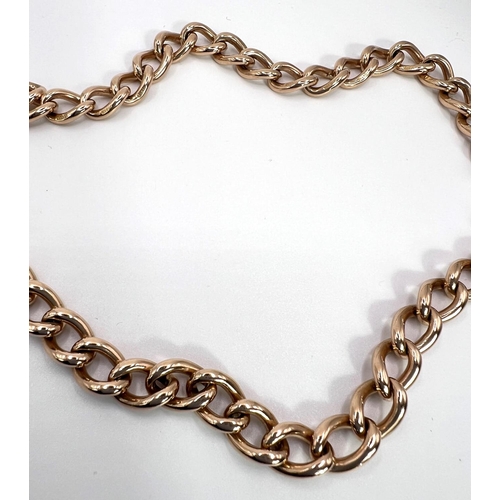 790 - A 9 carat hallmarked gold curb chain Albert with clip, 62.5gm, 39cm