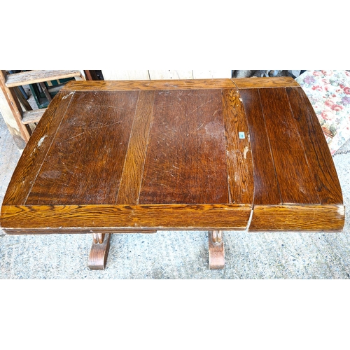 890 - A 1930's oak draw leaf dining table over bulbous legs, length 93cm, extended 153cm