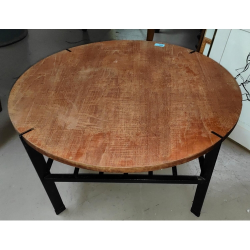 904 - A mid 20th century  Danish teak coffee table with wrought metal base and under shelf, diameter 69cm