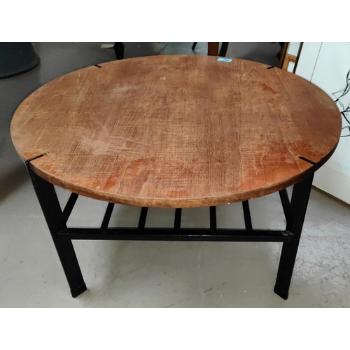 904 - A mid 20th century  Danish teak coffee table with wrought metal base and under shelf, diameter 69cm