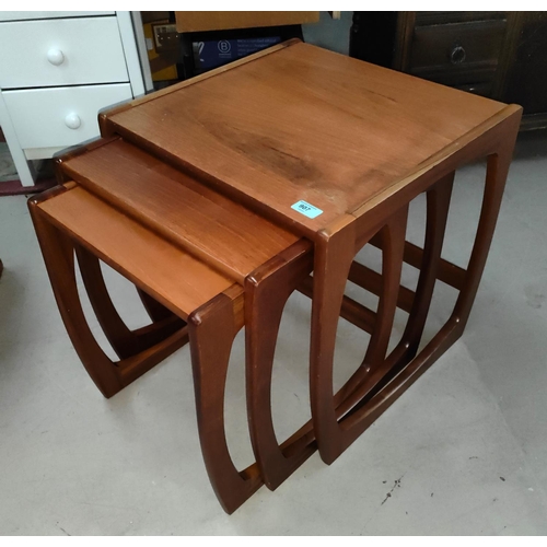 907 - A mid 20th century nest of three teak tables