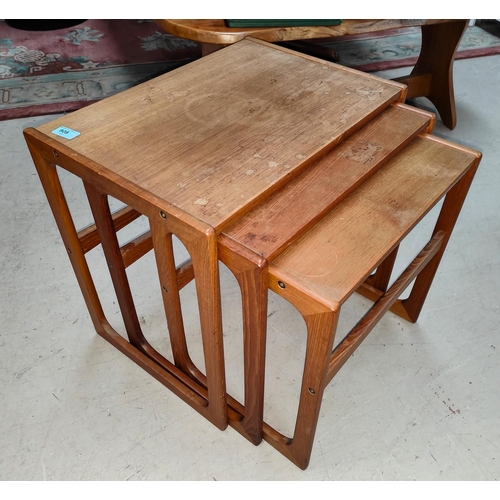 908 - A mid 20th century teak nest of three tables