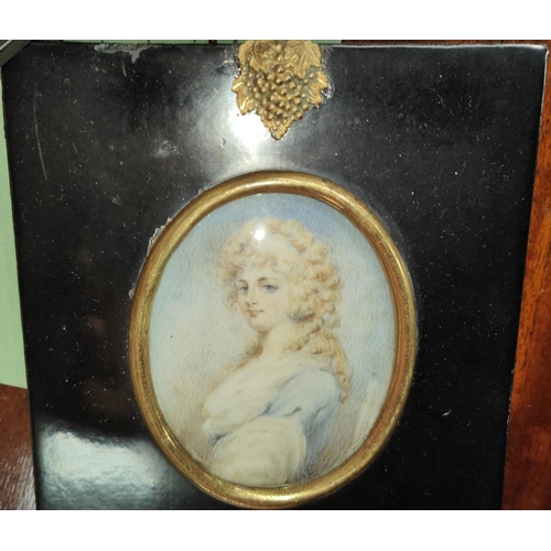 816 - A 19th century miniature portrait of a young woman with blonde hair and blue dress in ebonised frame... 