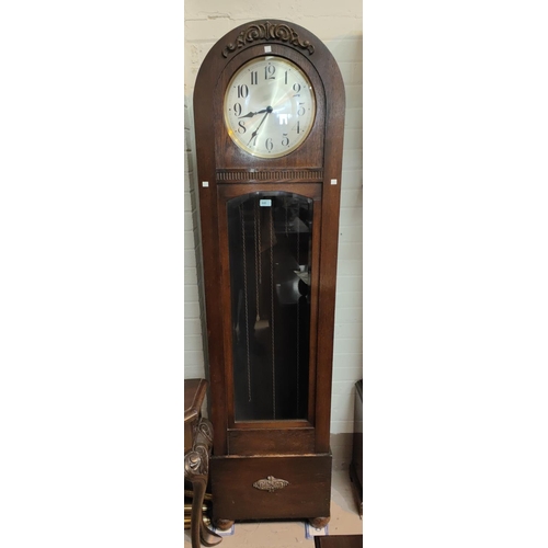 840 - A 1930's grandfather clock in oak dome top case, with triple weight driven movement, height 194cm