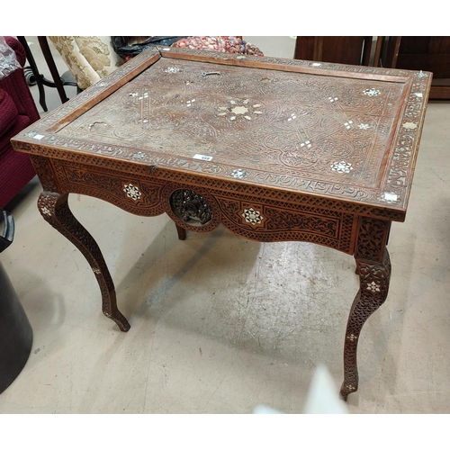 855 - A late 19th/early 20th century Moorish occasional table with extensively carved and inlaid rectangul... 