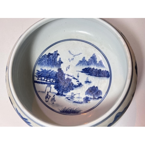 435A - A Chinese blue and white bowl, with traditional scenes and decoration and six character mark to base... 