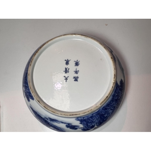 435A - A Chinese blue and white bowl, with traditional scenes and decoration and six character mark to base... 