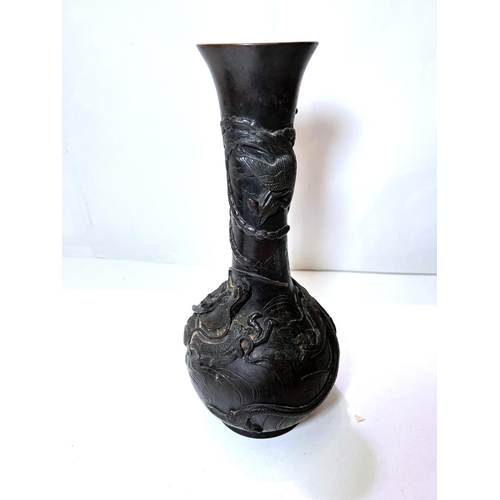 435B - A Chinese bronze vase with dragon and mythical bird decoration, with seal mark to base and wooden st... 