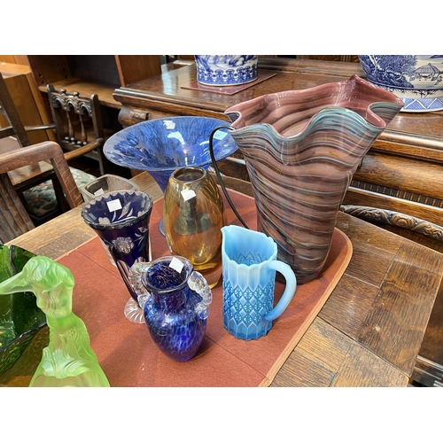 603 - A selection of coloured glass vases, table centres etc