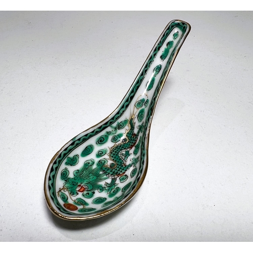 483A - A Chinese famille vert soup spoon decorated with dragon etc 12cm