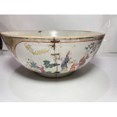 486A - A 18th century Chinese famille rose ceramic bowl with very fine decoration of groups meeting on hors... 