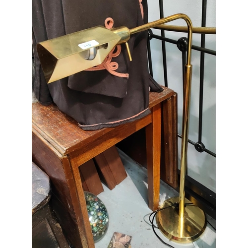 110 - An adjustable gilt metal standard/reading lamp