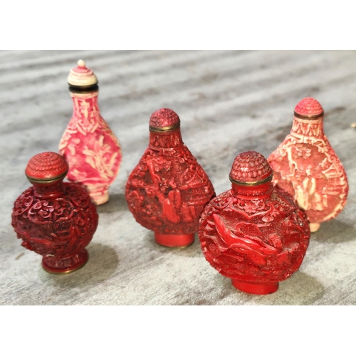 411A - Three Chinese Cinnabar coloured snuff bottles and two others