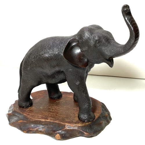 480 - A Japanese Meiji period elephant with raised trunk, on wooden stand, highly detailed work on skin et... 