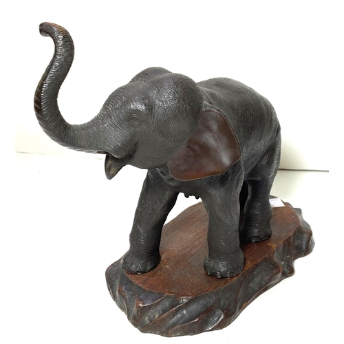 480 - A Japanese Meiji period elephant with raised trunk, on wooden stand, highly detailed work on skin et... 