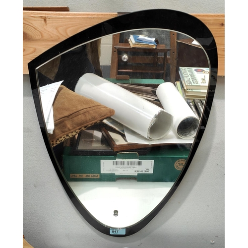 847 - A mid 20th century shaped mirror in black/clear glass