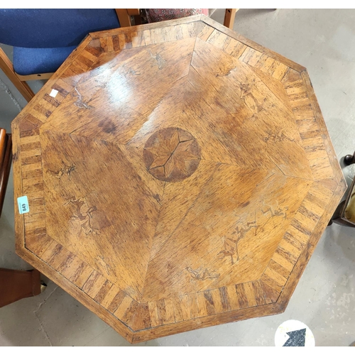 849 - An Eastern occasional table on pedestal with octagonal inlaid top