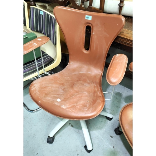 857 - A modern pair of designer swivel armchairs with tan coloured seats and backs