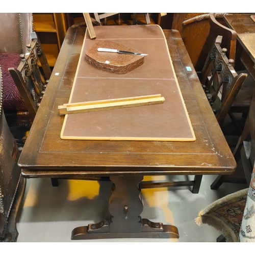 870 - An Ercol draw leaf refectory dining table and four chairs matching Ercol chairs (2+2)