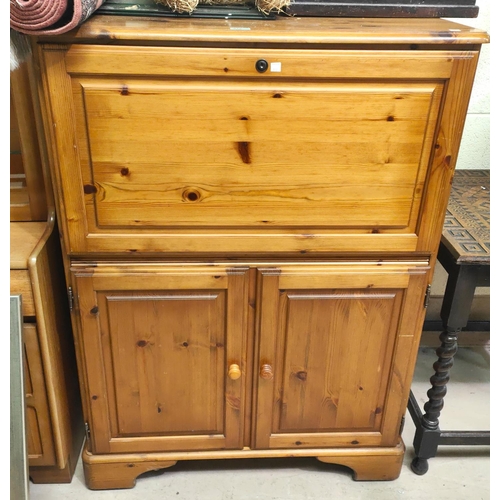 872 - A modern pine side cabinet with fall front upper section and double cupboard below