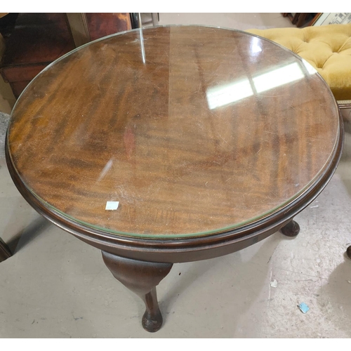 882 - A mahogany circular coffee table; an occasional table/magazine rack; a Victorian footstool; an Edwar... 