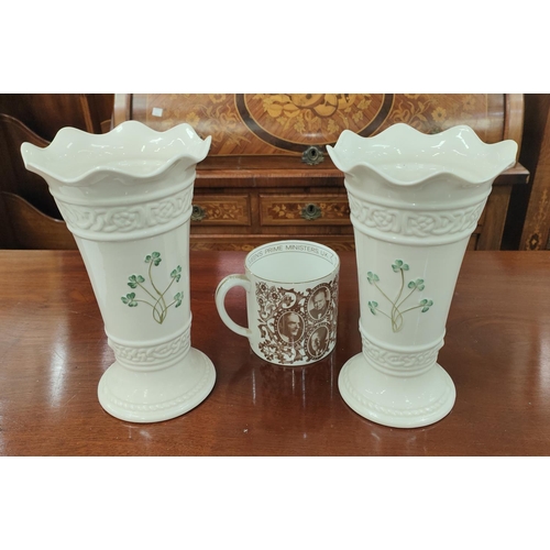 595B - A pair of large Belleek vases with clover decoration in green and green mark to base 