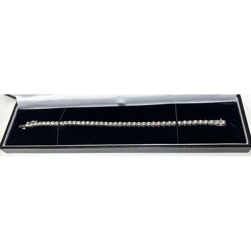 716A - A 9 carat white gold ‘Tennis Bracelet’ set 42 diamonds (approximately 2 - 3 carats, each... 