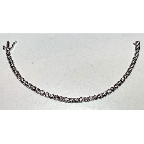 716A - A 9 carat white gold ‘Tennis Bracelet’ set 42 diamonds (approximately 2 - 3 carats, each... 