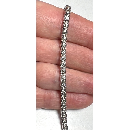 716A - A 9 carat white gold ‘Tennis Bracelet’ set 42 diamonds (approximately 2 - 3 carats, each... 