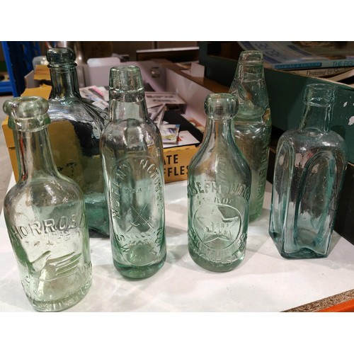 151 - An old copper coal bucket with a selection of 13 various old glass bottles, inc. Manchester brewery ... 