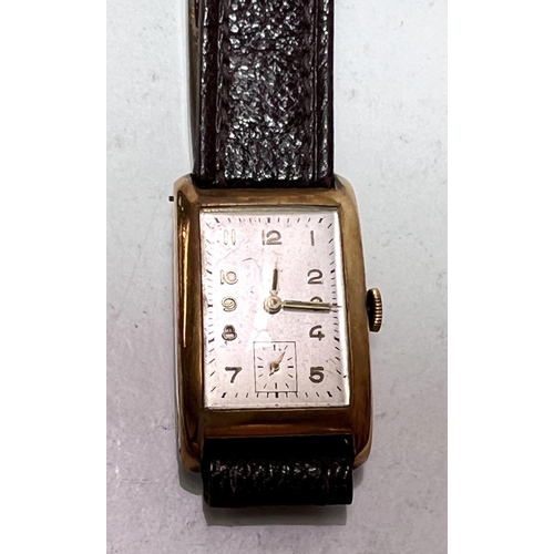 710 - A 1930's gent's Tank watch with 18 carat gold case with Arabic numerals and seconds complication wit... 