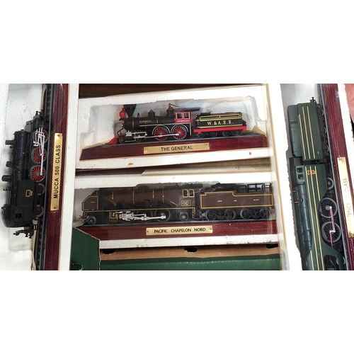 221 - A collection of 12 Atlas display locomotives