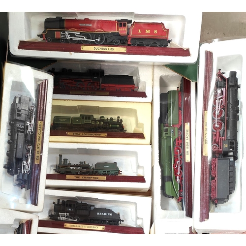 221 - A collection of 12 Atlas display locomotives