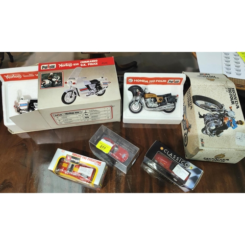 277 - A boxed Polistil Norton 850 Police bike 1:15, another Polistil Honda 750 Four both boxed, three smal... 