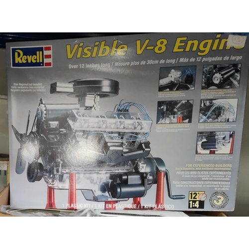 298 - A Revell model kit Visible V-8 Engine 1:4 boxed (packaging inside seems intact) a selection of other... 