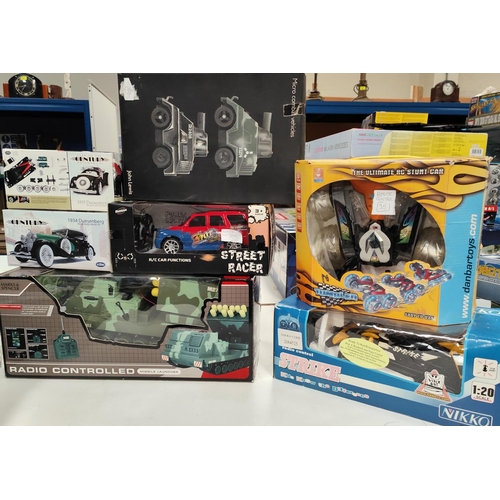 301 - A selection of boxed remote control and display vehicles including Nikko Strike etc