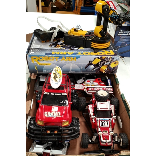 302 - A selection of loose Taiyo and other remote controlled vehicles a robot arm etc