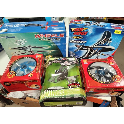 304 - A selection of remote control and battery controlled flying vehicles originally boxed