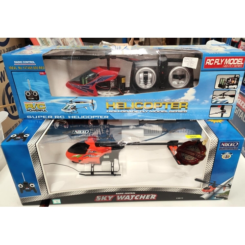 305 - A Nikko radio controlled Sky Watcher helicopter boxed and another radio controlled helicopter boxed&... 