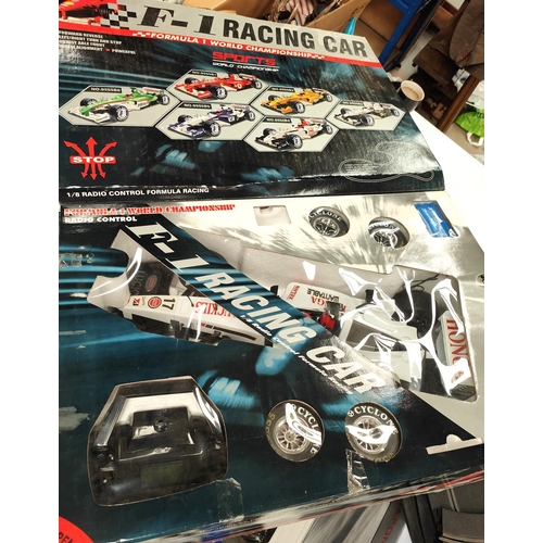 307 - A boxed Radio controlled F-1 racing car by Daied 1:8 scale and a Micro Scalextric Mercedes boxed set