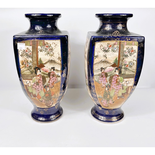 400 - An early 20th century pair of Japanese satsuma vases of square baluster form, with reserve panels of... 