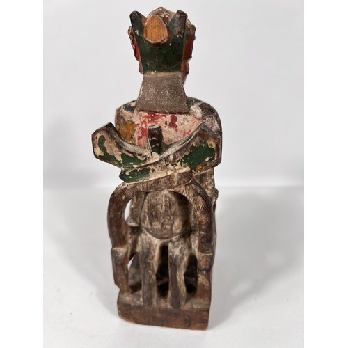 422 - A 19th century Chinese carved wooden figure sat on chair with animal features, with original gilt an... 