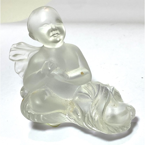 533 - René Lalique:  a reclining figure of a cherub, 11cm