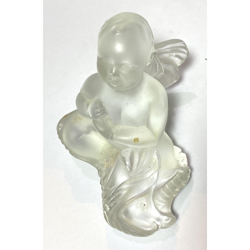 533 - René Lalique:  a reclining figure of a cherub, 11cm