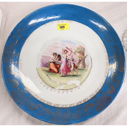 589 - A Vienna style large dish with gilt and blue border and central panel, diameter 34.5cm