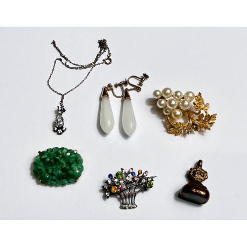 608 - An Edwardian gem set necklace on fine chain; a pair of opaque white drop earrings; a jade coloured b... 