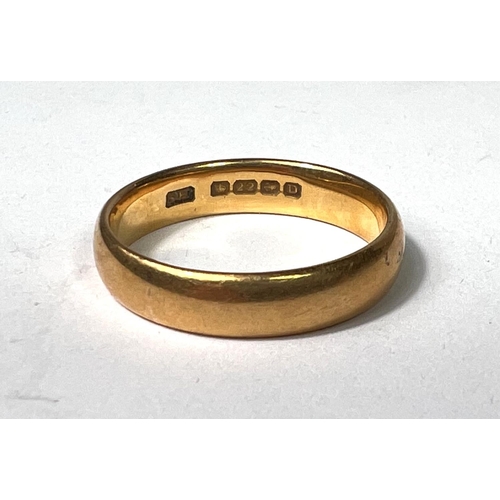 636 - A 22 carat hallmarked gold wedding ring, size O/P, 5.7gm