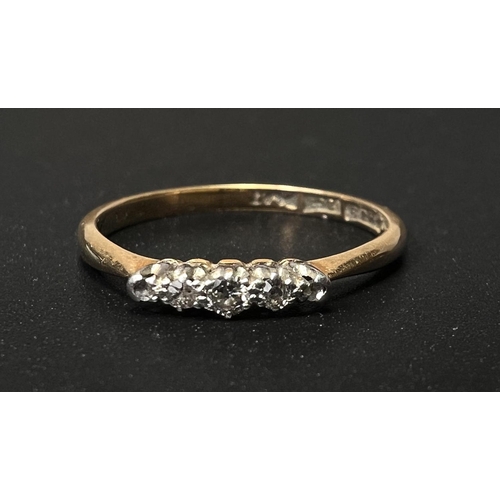 640 - A yellow metal ring stamped '18ct', set 5 small graduating diamonds, size 'N', 2gm